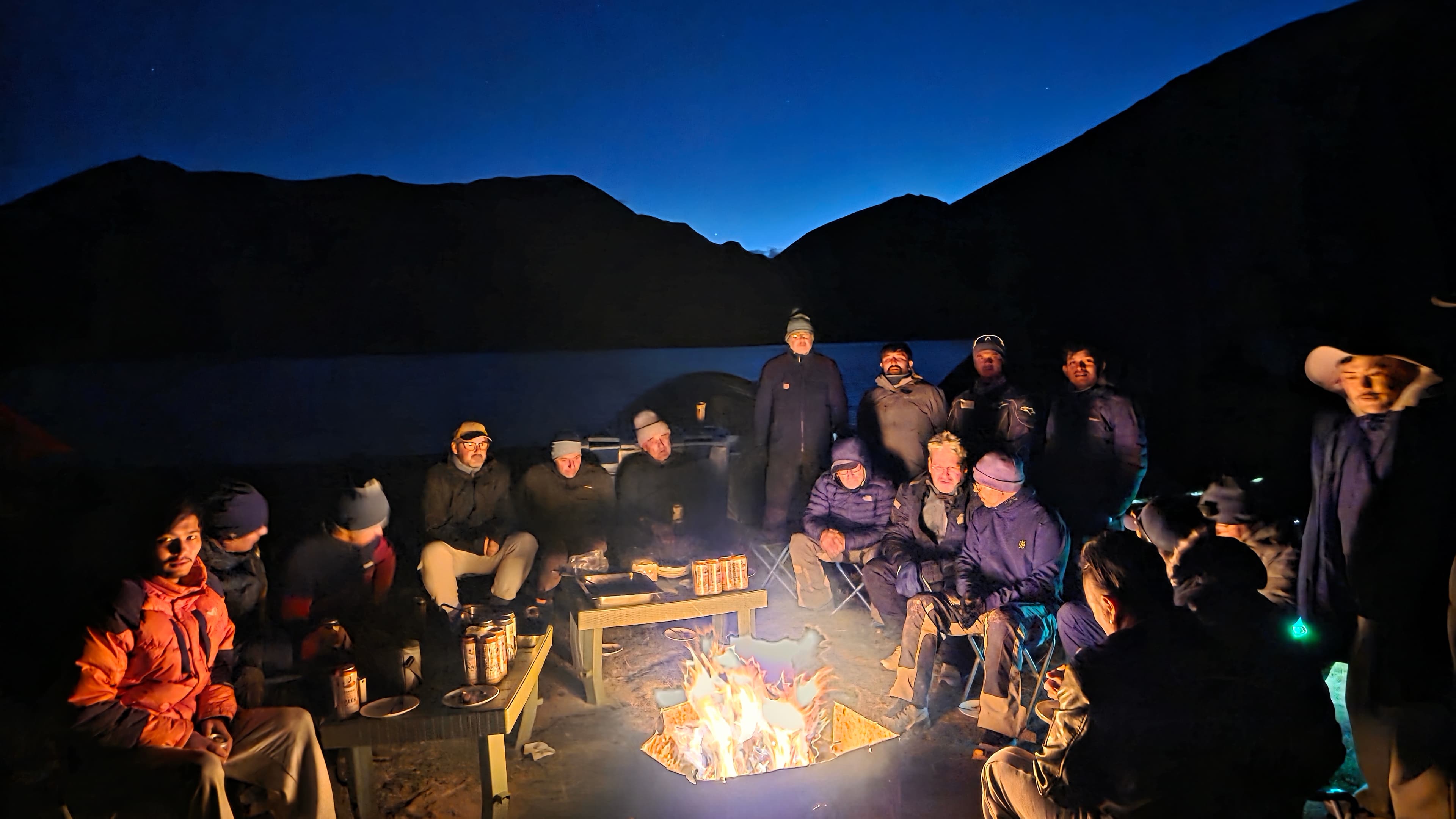 Group around a campfire at twilight