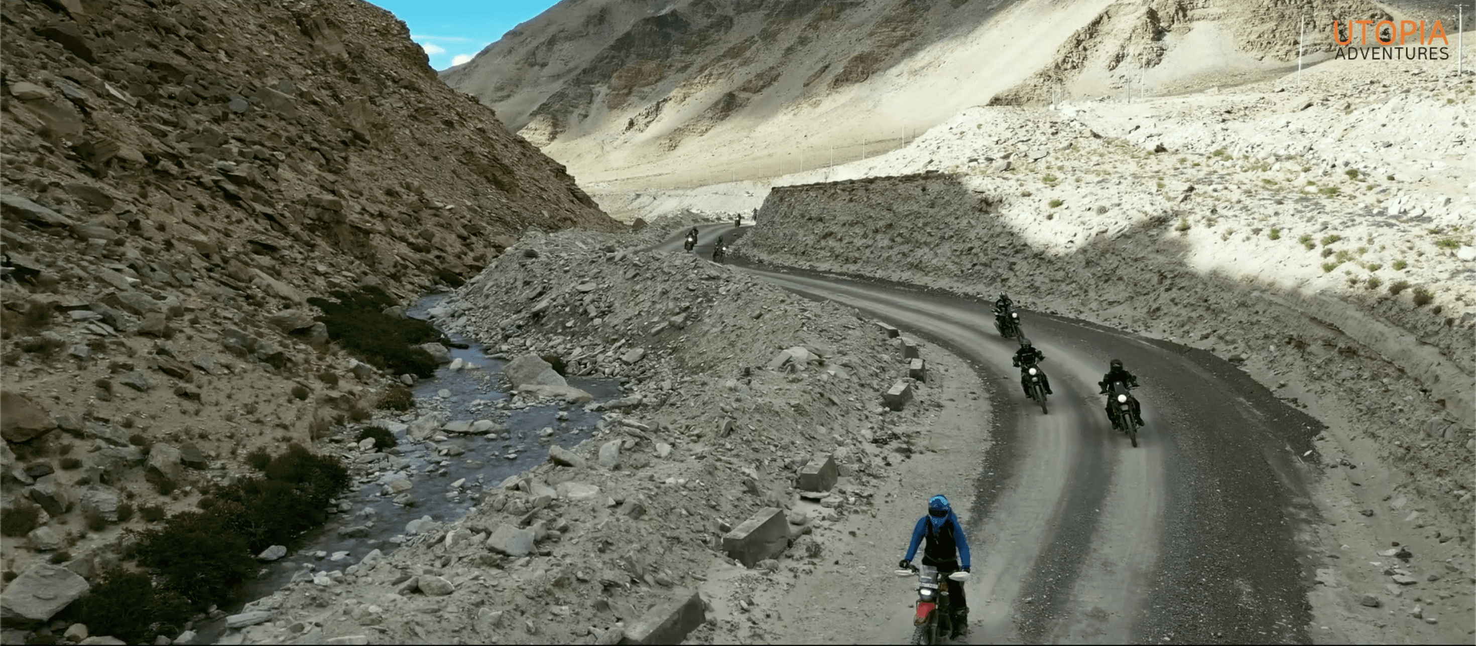 Riders on a winding mountain road